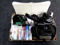 A box containing Nintendo Game Cube in Pokemon carry bag, two Wii consoles, WiiFit board,