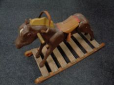 A miniature wooden rocking horse