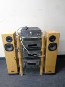 A five piece Denon hifi separates system on stand together with a pair of Rega Alya tower speakers