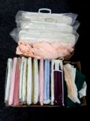 A box of assorted bedding (sealed), table linen,