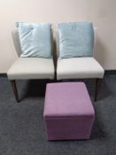 A pair of contemporary bedroom chairs with cushions together with a foot cube