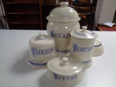A Ditto blue and cream lidded bread bin biscuit barrel, butter and cheese dish,