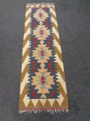 A fringed Kilim carpet runner