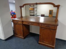 A 19th century oak pedestal mirror backed sideboard