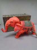 A mid 20th century plastic mechanical elephant with key