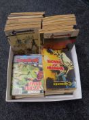 A box containing 20th century Commando and Football pocket comics