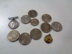 A collection of eight assorted commemorative crowns together with a First World War medal and a fob