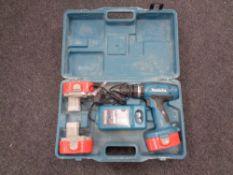 A cased Makita 18 V electric drill with three batteries and charger