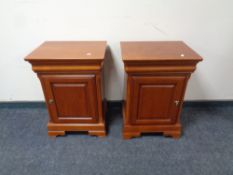 A pair of Olympus Furniture cherry wood bedside cabinets fitted a drawer