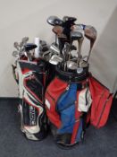 Four golf bags containing assorted irons,