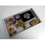 A box of Russian medals and badges, pocket watch, plated vesta case, pocket lighter,