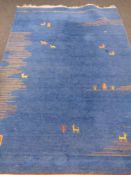 An Indo Gabbeh fringed woolen rug on blue ground