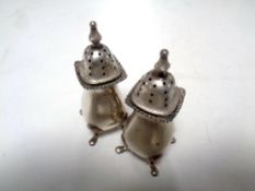 A pair of silver salt and pepper pots bearing Birmingham hallmarks CONDITION REPORT: