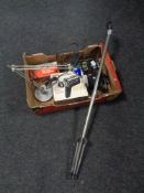 A box containing a microphone stand together with two boxed microphones, cameras,