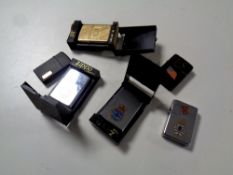 A box containing six assorted Zippo lighters