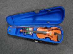 A Chinese violin and bow in soft carry case