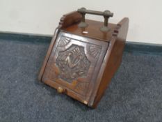 A 19th century carved coal receiver with brass handle