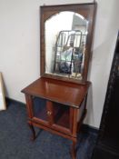 An Edwardian framed bevel edged mirror together with a double door cabinet on cabriole legs