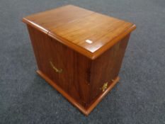 A contemporary decanter box with brass fittings and handle