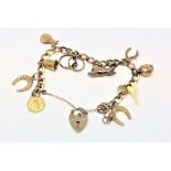 A 9ct gold charm bracelet, 19.g.