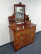 An Edwardian four drawer dressing chest