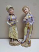 A pair of antique continental bisque figures,