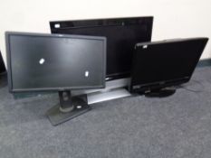 A Polaroid 26'' LCD TV together with a Technica TV and a Dell computer monitor