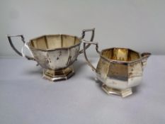 A Birmingham silver cream jug and sugar basin, hallmarks rubbed,