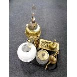 A tray of brass embossed oil lamp base, with glass shade, oil can,