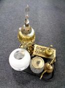 A tray of brass embossed oil lamp base, with glass shade, oil can,
