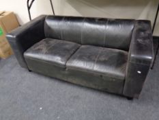 A black leather two seater reception settee