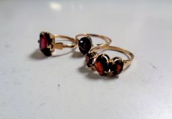 Two 9ct gold dress rings together with a further gold ring (hallmarks rubbed)