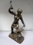 A heavy bronze figure of a Blacksmith