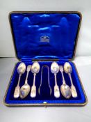 A set of six Sheffield silver teaspoons with sugar tongs,