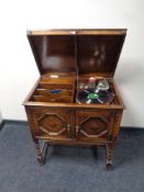 An early 20th century gramophone in oak cabinet on raised barley twist legs by Apollo