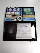 A vintage first aid tin with contents,