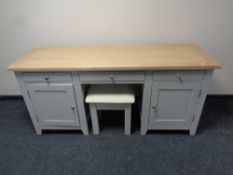 A contemporary oak topped twin pedestal dressing table on painted base fitted cupboards and drawers