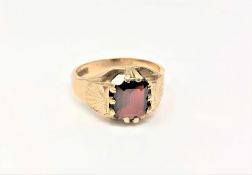 A 9ct gold Gentleman's ring set with garnet, 7.3g, size T.