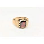 A 9ct gold Gentleman's ring set with garnet, 7.3g, size T.