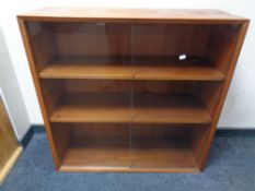 A set of mid 20th century Lyby Mobler Danish teak sliding glass door bookshelves