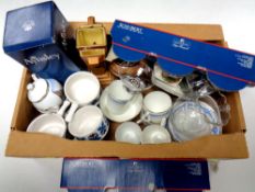 A box containing part tea services, assorted glassware,