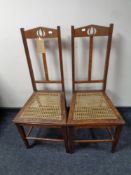 A pair of Arts & Crafts oak rush-seated chairs in the manner of Shapland and Petter