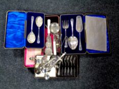 A tray of cased cutlery sets including cake forks, servers,