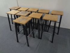 A set of ten science lab stools on metal legs