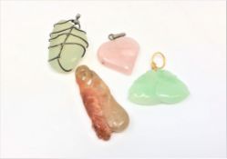 Four stone pendants including Chinese jade etc.