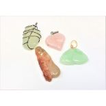 Four stone pendants including Chinese jade etc.