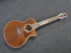 An Ibanez twelve string electro-acoustic guitar model AE2412-NT.