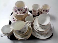 A tray containing two part bone china tea services by Paragon and Lady Beth