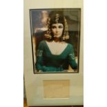 CINEMA, signed album page (5 x 4) by Elizabeth Taylor, overmounted beneath colour photo, half-length