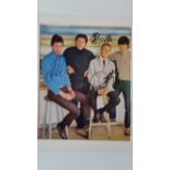 POP MUSIC, The Who, signed colour magazine photo by Roger Daltry, John Entwistle & Pete Townsend,